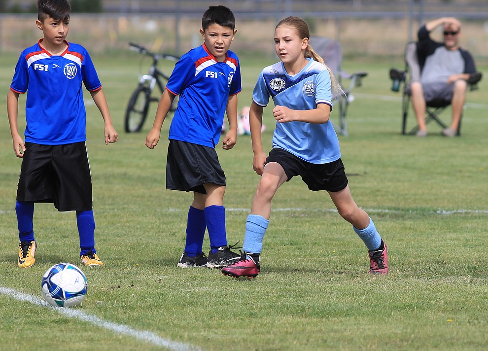 A Williams AYSO player works the ball down the field in a game against Flagstaff July 14 at the WEMS field.