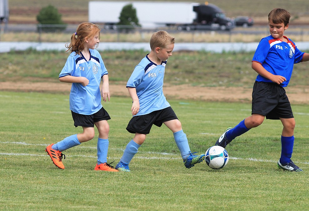 Williams AYSO players battle for the ball in a game against Flagstaff July 14 at the WEMS field.