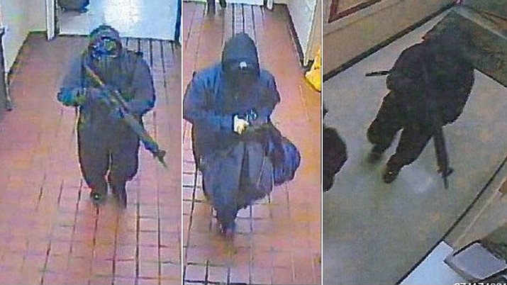 The FBI says two masked men dressed in black robbed the Mazatzal Casino in Payson, Arizona just after midnight on Tuesday, July 17, 2018. The men carried a long gun and pistols and fired multiple rounds inside the casino. (FBI photo)
