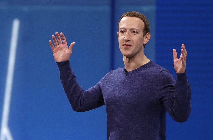 In this May 1, 2018, file photo, Facebook CEO Mark Zuckerberg makes the keynote address at F8, Facebook's developer conference in San Jose, Calif. Remarks from Zuckerberg have sparked criticism from groups such as the Anti-Defamation League. Zuckerberg, who is Jewish, told Recode's Kara Swisher in an interview that although he finds Holocaust denial "deeply offensive," such content should not be banned from Facebook. (AP Photo/Marcio Jose Sanchez, File)
