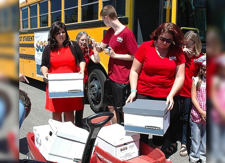 August 2017 file photo - Volunteers deliver petitions signed by Arizona voters to the Secretary of State’s office in an effort to force a vote that would overturn the expansion of school vouchers. At issue is the decision last year by the Republican-controlled Legislature to remove any conditions from who is entitled to get taxpayer dollars to attend private or parochial schools. (Howard Fischer/Capitol Media Services file photo)

