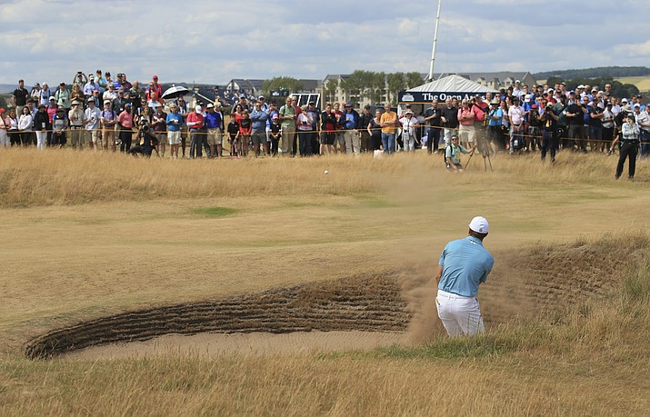 Jordan Spieth of the US hits out of a bunker on the 15th hole during the first round of the British Open Golf Championship in Carnoustie, Scotland, Thursday July 19, 2018. (Jon Super/AP)