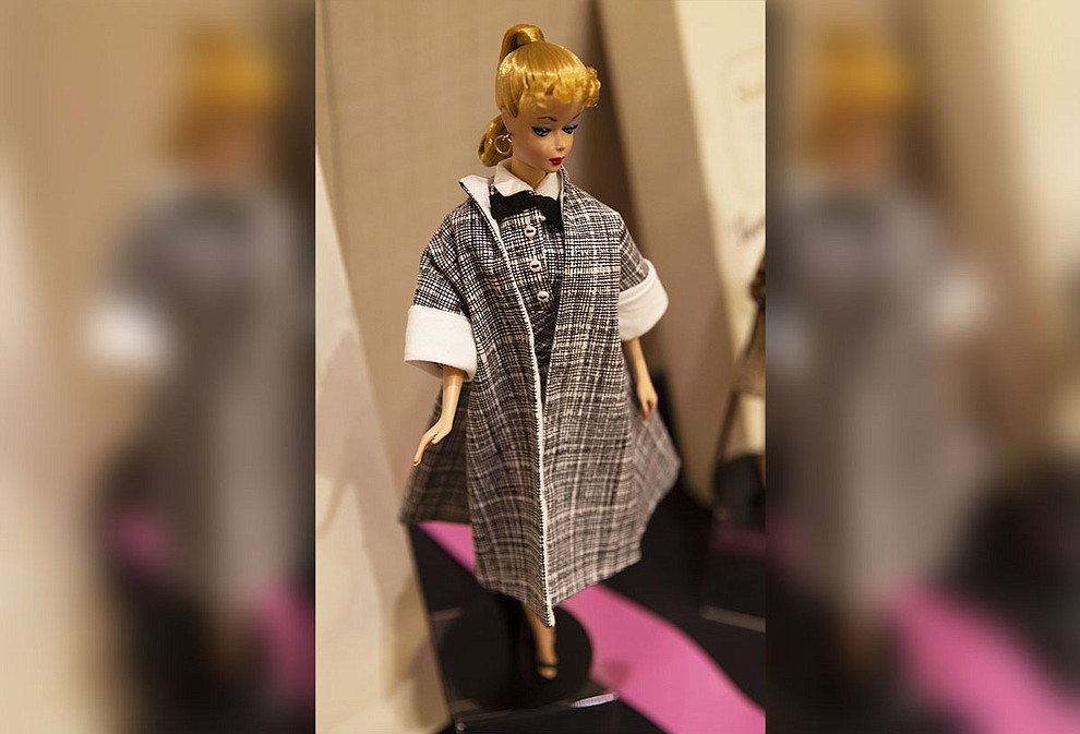 Before the feminist movements in the 1960s, the eyes on Barbie dolls, like this one, demurely pointed downward. Mattel changed it so that the dolls could look forward to reflect changing attitudes towards women. (Photo by Vivian Meza/Cronkite News)