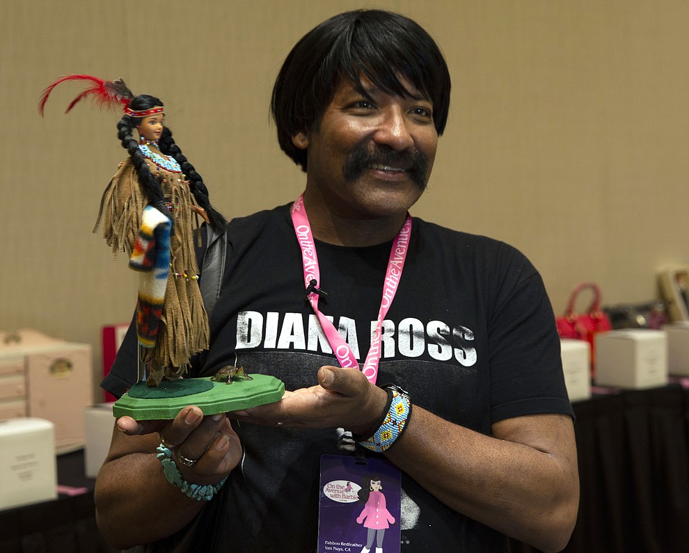 Pabboo Redfeather, a designer and artist, says he has been collecting Barbies since he was 5 and started a Black Barbie club in 1980. (Photo by Vivian Meza/Cronkite News)