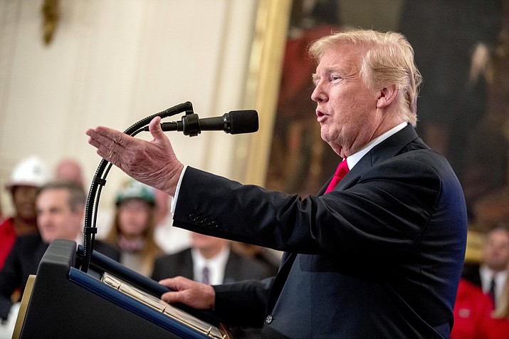 In this July 19, 2018 file photo, President Donald Trump speaks before signing an Executive Order that establishes a National Council for the American Worker during a ceremony in the East Room of the White House in Washington. Trump said he’s willing to hit all imported goods from China with tariffs, sending U.S. markets sliding before the opening bell, Friday, July 20.  In a taped interview with the business channel CNBC, Trump said “I’m willing to go to 500,” referring roughly to the $505.5 in goods imported last year from China.  (Andrew Harnik/AP, File)