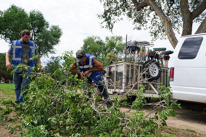 Members of the Coalition for Compassion and Justice (CCJ)/City of Prescott homeless work program pick up debris at the Antelope Hills Golf Course last week after a monsoon storm. The work crew got started recently as a part of the city’s Change for the Better program. (Cindy Barks/Courier)