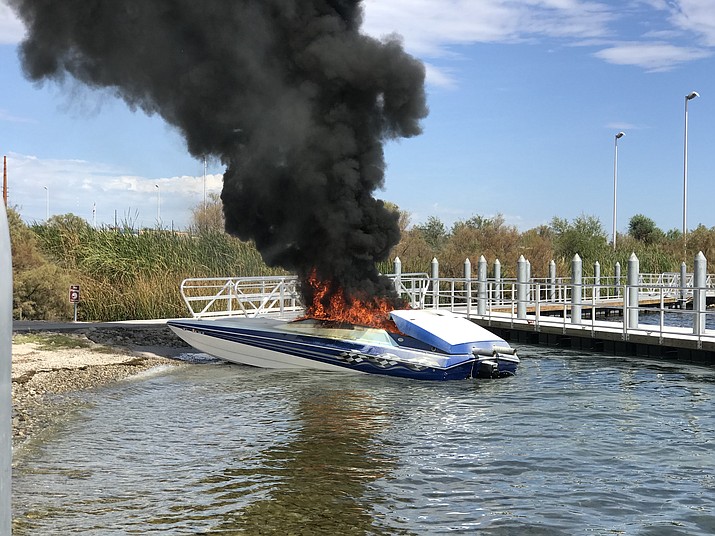 Black smoke pours off a 25-foot Global Marine boat Saturday on Lake Havasu. (Mohave County Sheriff's Office photo)