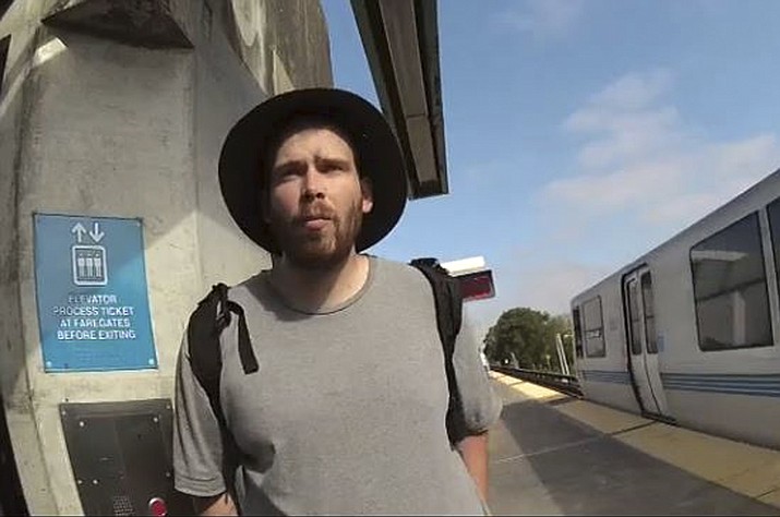 In this surveillance camera image released Monday, July 23, 2018, by Bay Area Rapid Transit is John Lee Cowell, a suspect wanted in the stabbings of two women at a BART station in Oakland, Calif. A man fatally stabbed an 18-year-old woman in the neck and wounded her sister as they exited a train at a Northern California subway station in what officials said Monday appeared to be a random attack. The suspect attacked the sisters Sunday night as they left a train at the Bay Area Rapid Transit's MacArthur Station in Oakland. He then fled, BART spokesman Jim Allison said. (Bay Area Rapid Transit via AP)

