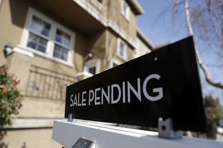 In this March 6, 2018, photo, a sign advertises the pending sale of a home in San Jose, Calif. Economists expect that sales of previously occupied U.S. homes edged higher in June. (Marcio Jose Sanchez/AP, File)