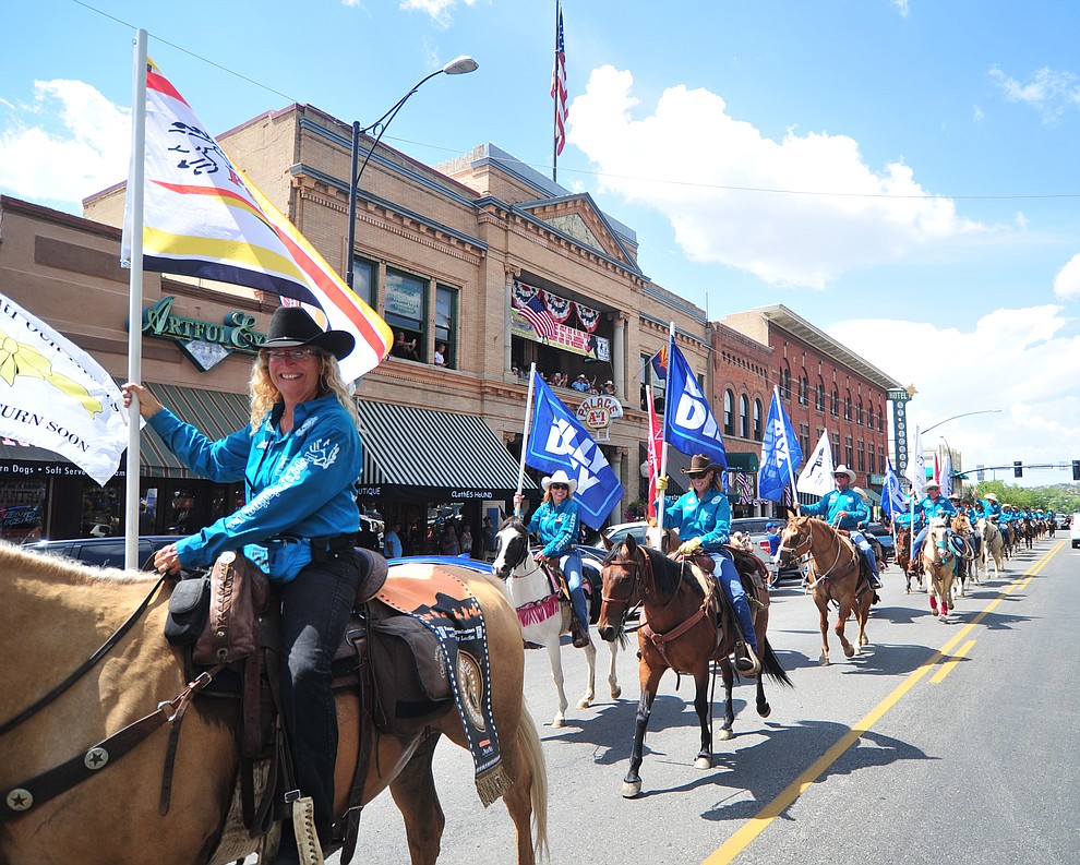 Almost 100 horseback riders ride along Motezuma Street as part of the 13th annual Whiskey Row Shoout and National Day of the Cowboy in Prescott Saturday, July 28, 2018. (Les Stukenberg/Courier)