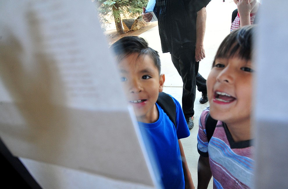 Second grader Elias Nehoitewa and third grader Matthias Hayah look at whose in their classes at Abia Judd Elementary School Thursday, August 2, 2018 as Prescott Unified School District starts the 2018-19 school year. (Les Stukenberg/Courier)
