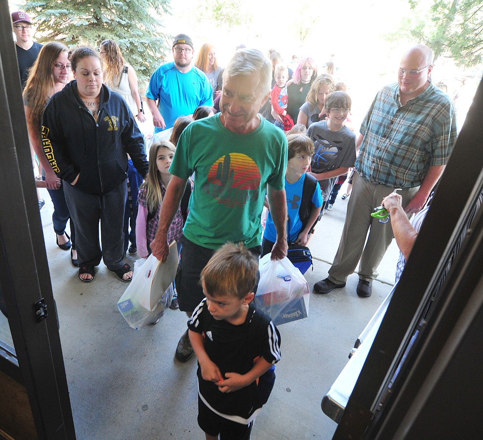 Parents and students head into the school at Abia Judd Elementary School Thursday, August 2, 2018 as Prescott Unified School District starts the 2018-19 school year. (Les Stukenberg/Courier)
