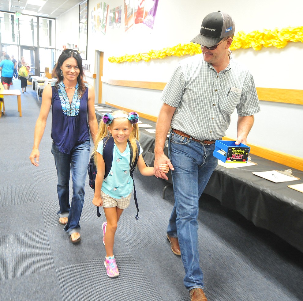 Rick and Sarah Kieckhefer walk second grader Kodi to class at Abia Judd Elementary School Thursday, August 2, 2018 as Prescott Unified School District starts the 2018-19 school year. (Les Stukenberg/Courier)