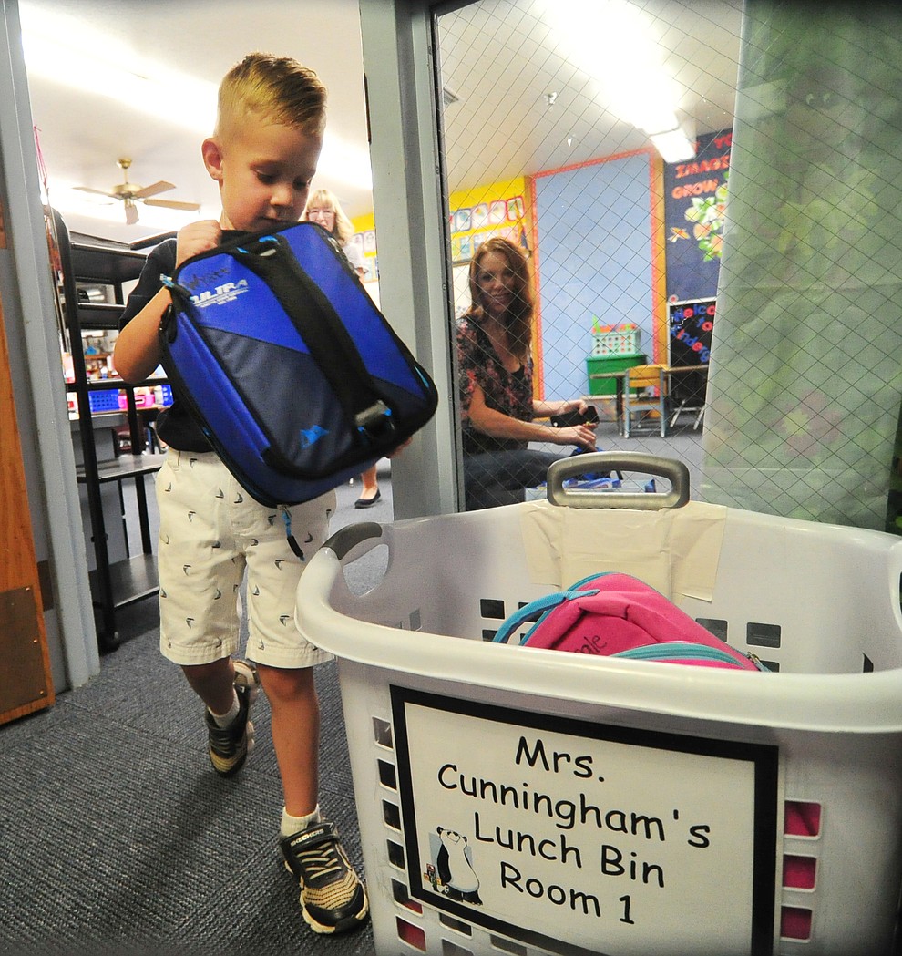 Kindergartener Wyatt Baldwin puts his lunch box up at Abia Judd Elementary School Thursday, August 2, 2018 as Prescott Unified School District starts the 2018-19 school year. (Les Stukenberg/Courier)