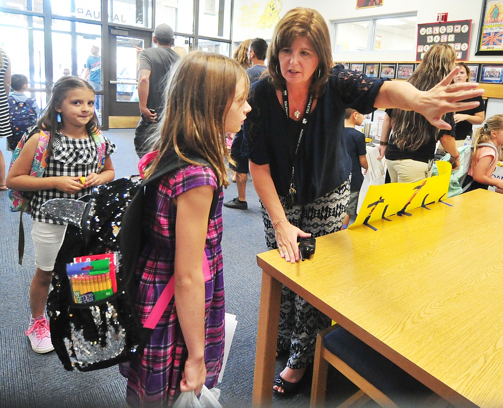 Principal Stephanie Hillig directs fourth grader Shealee Reynolds to her class at Abia Judd Elementary School Thursday, August 2, 2018 as Prescott Unified School District starts the 2018-19 school year. (Les Stukenberg/Courier)