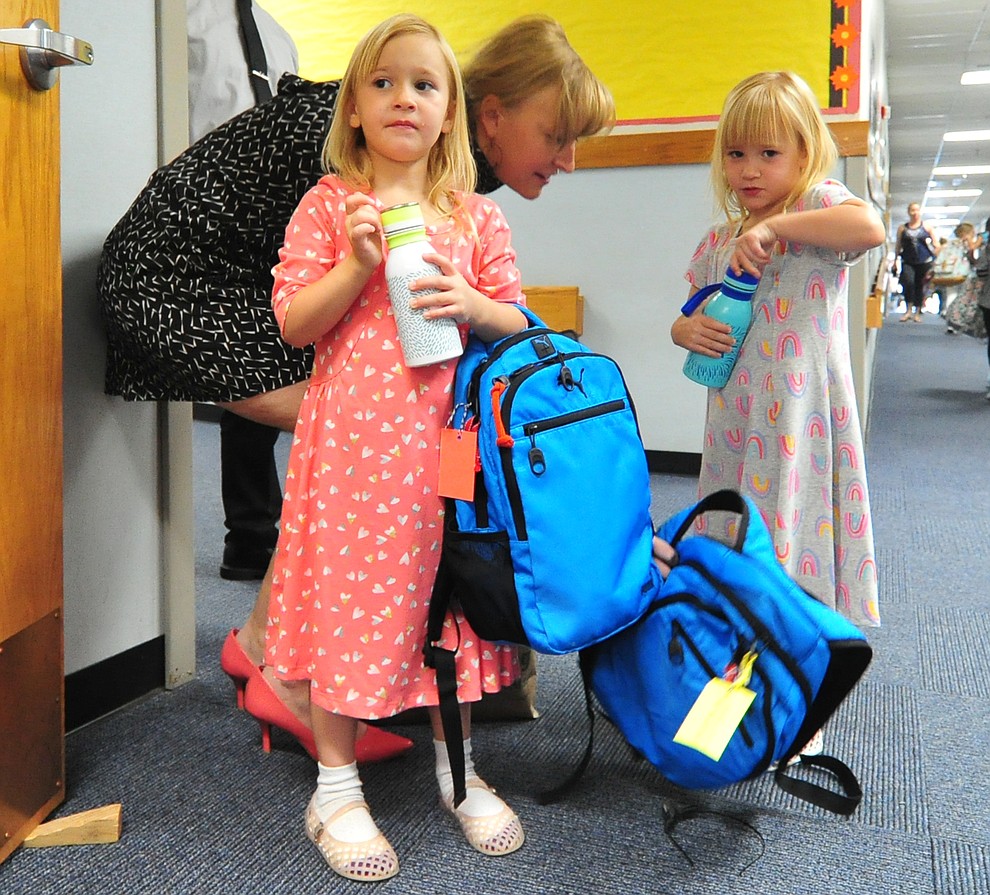 Meghan Anderson says goodbye to kindergarten twins Karlee and Reagan at Abia Judd Elementary School Thursday, August 2, 2018 as Prescott Unified School District starts the 2018-19 school year. (Les Stukenberg/Courier)