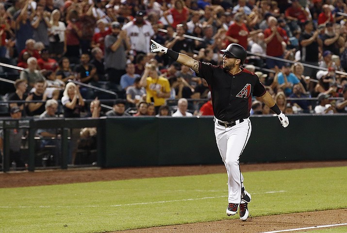 Arizona Diamondbacks' David Peralta points to the crowd as he rounds the bases after hitting a home run against the San Francisco Giants during the second inning of a baseball game Friday, Aug. 3, 2018, in Phoenix. (Ross D. Franklin/AP)