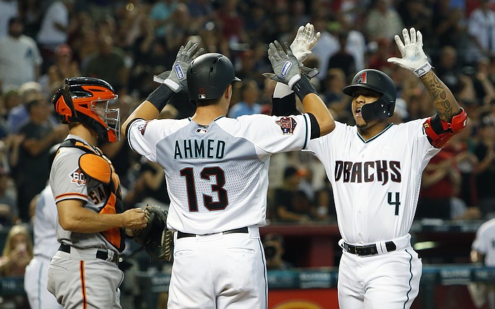 Arizona Diamondbacks Ketel Marte (4) celebrates with Nick Ahmed after hitting a two-run home run against the San Francisco Giants in the first inning during a baseball game, Saturday, Aug. 4, 2018, in Phoenix. (Rick Scuteri/AP)