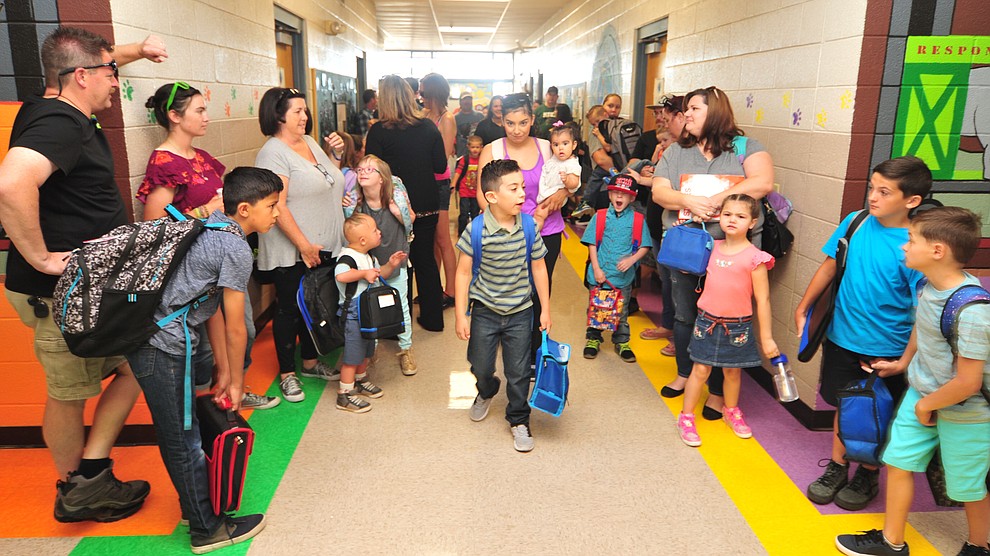 Parents and students wait for in the hallway on the first day of school at Coyote Springs Elementary in Prescott Valley Monday, August 6, 2018. (Les Stukenberg/Courier)