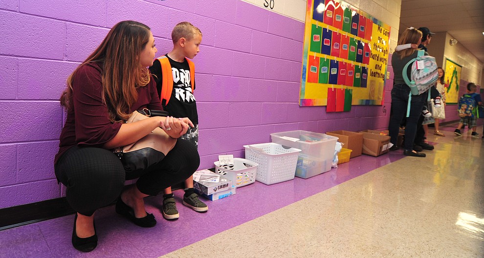 Brandy Reed waits with her kindergartner Liam Reed on the first day of school at Coyote Springs Elementary in Prescott Valley Monday, August 6, 2018. (Les Stukenberg/Courier)