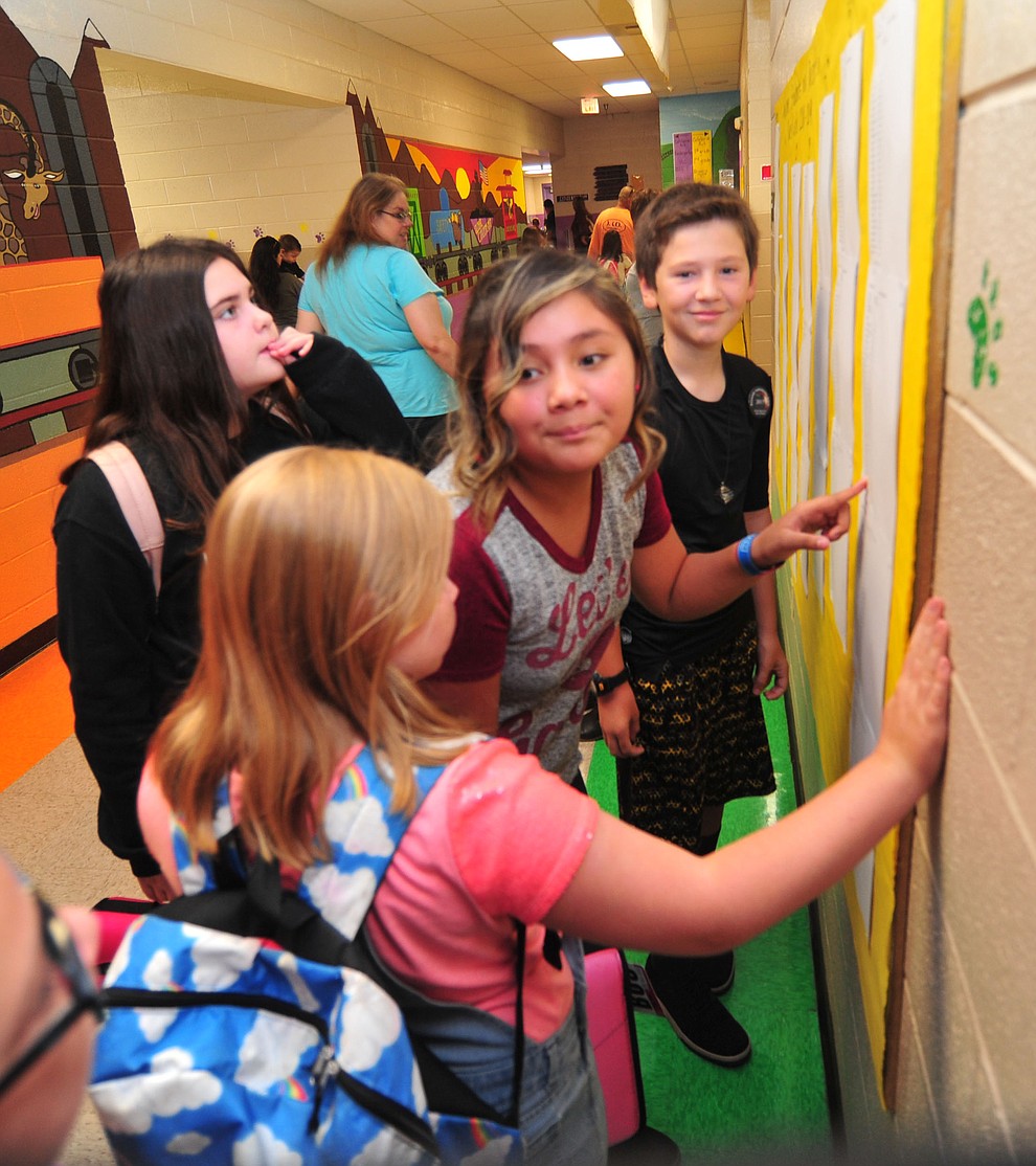 Sixth graders check the class lists during the first day of school at Coyote Springs Elementary in Prescott Valley Monday, August 6, 2018. (Les Stukenberg/Courier)