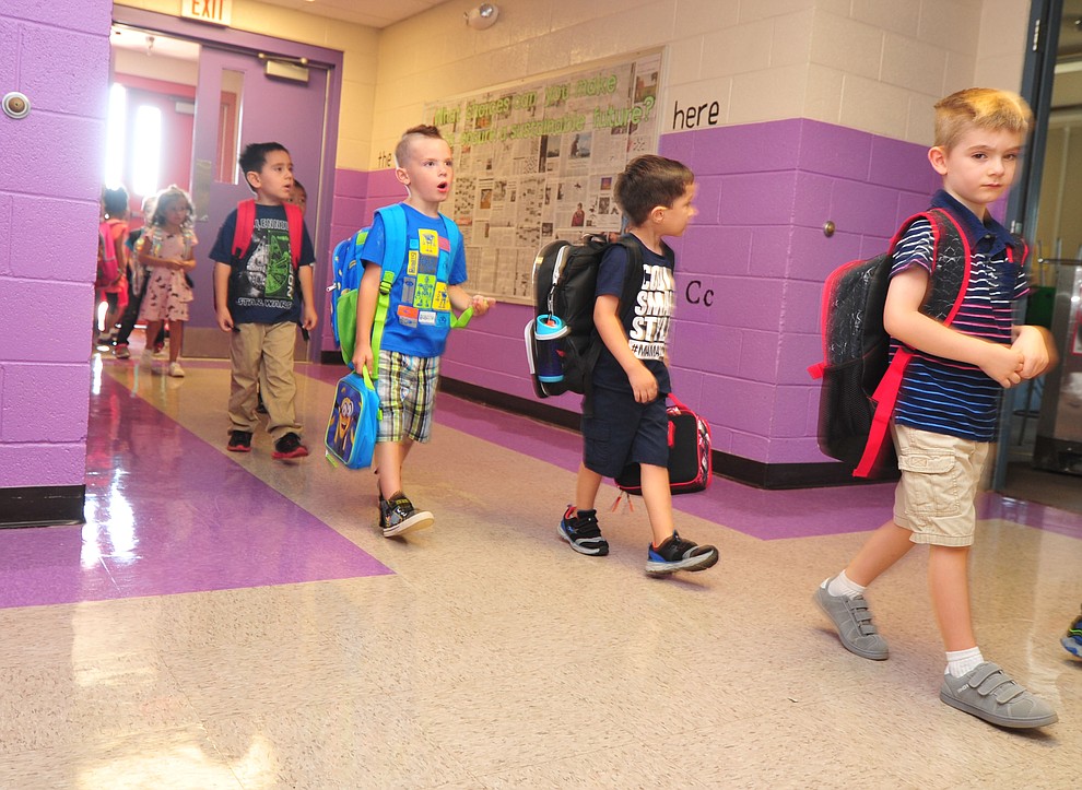 Kindergartners head to class during the first day of school at Coyote Springs Elementary in Prescott Valley Monday, August 6, 2018. (Les Stukenberg/Courier)
