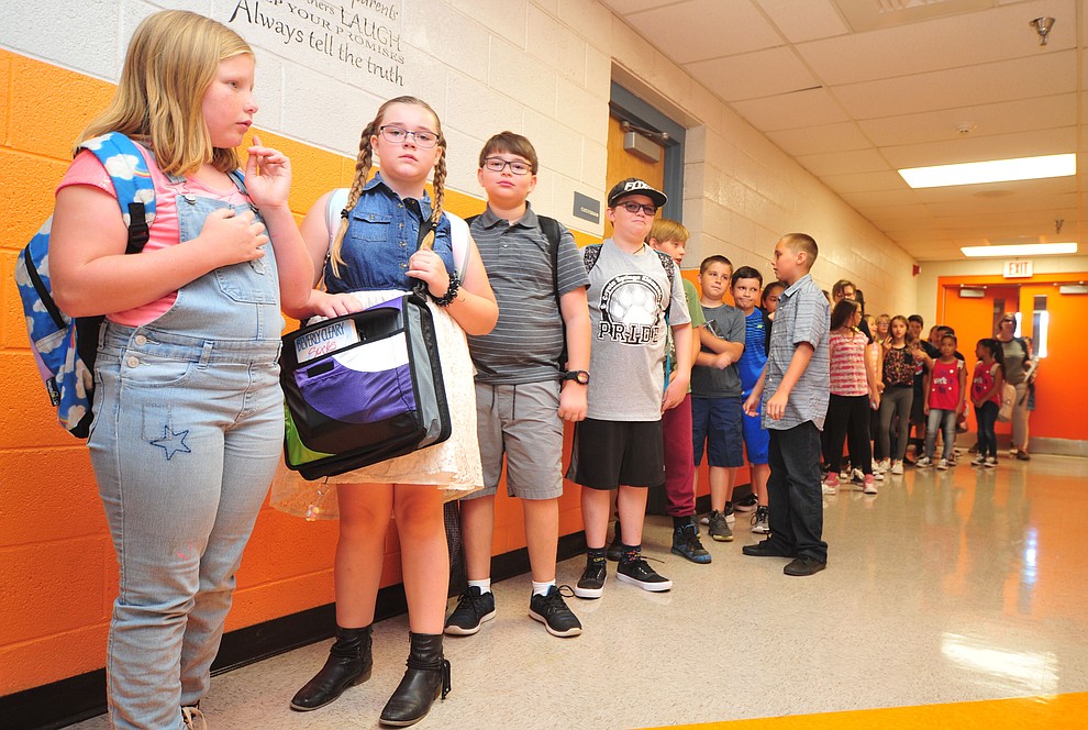 Students wait in the hallway during the first day of school at Coyote Springs Elementary in Prescott Valley Monday, August 6, 2018. (Les Stukenberg/Courier)