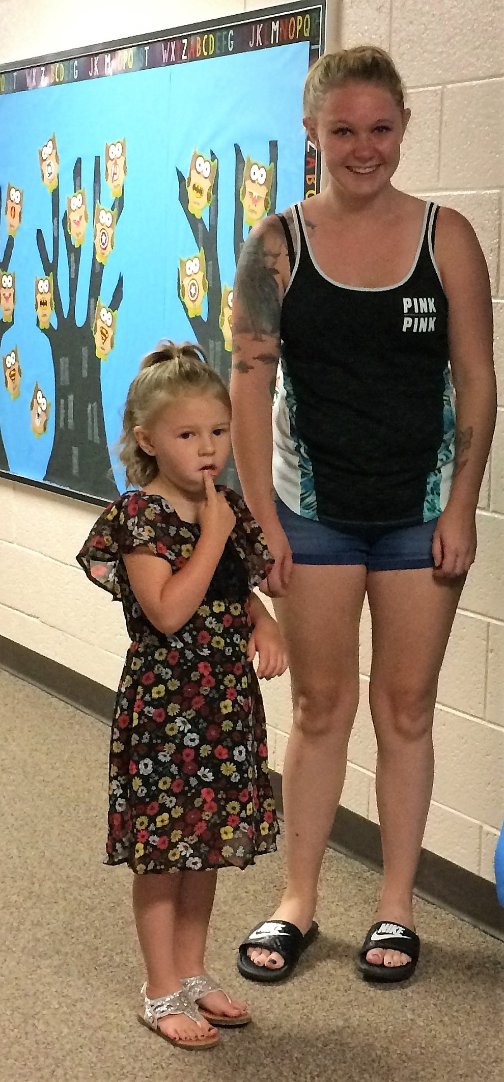 Alyia McAlpin is Dawnae ChristianÕs first child to attend kindergarten, and neither one were having a particularly tough time on the first day of school Monday, Aug. 6, at Mountain View Elementary School in Prescott Valley. (Sue Tone/Courier)