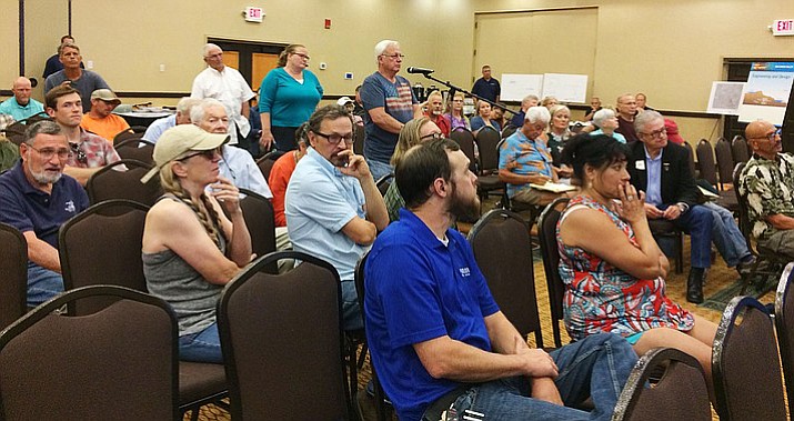 People with questions and comments on the proposed ITC Big Chino Valley Pumped Storage Project line up June 27, at the Prescott Resort. About 60 people attended the community meeting, most from Chino Valley and Paulden. (Sue Tone/Prescott Daily Courier)