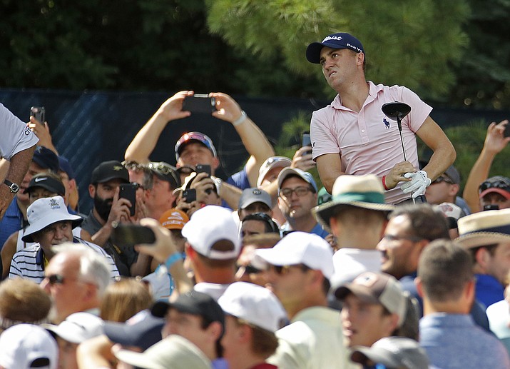 Justin Thomas watches his tee shot on the 15th hole during a practice round for the PGA Championship golf tournament at Bellerive Country Club, Wednesday, Aug. 8, 2018, in St. Louis. (Charlie Riedel/AP)

