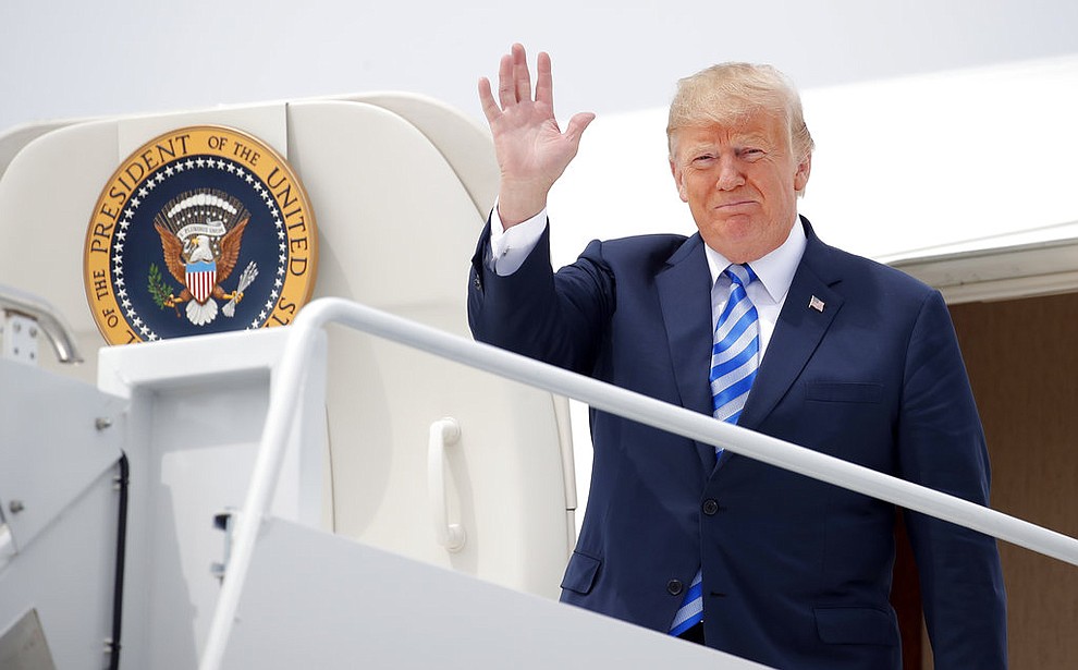 President Donald Trump waves as he arrives on Air Force One at Wheeler-Sack Army Air Field in Fort Drum, N.Y., Monday, Aug. 13, 2018. (AP Photo/Carolyn Kaster)