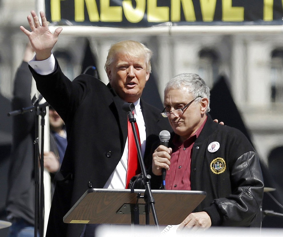 FILE - In this April 1, 2014 file photo, Donald Trump, left, and Carl Paladino appear together during a gun rights rally at the Empire State Plaza in Albany, N.Y. Several local Republicans, including Paladino, have stepped forward to run for Chris Collins' Congressional seat after the Republican said he won't run for re-election in the face of insider trading charges. (AP Photo/Mike Groll, File)