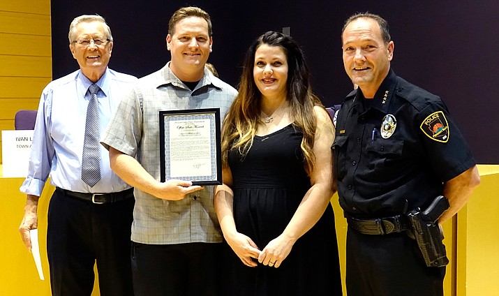 Pictured are, from left: Mayor Harvey Skoog, Scott and Mindy Monteith, and Police Chief Bryan Jarrell. (Courtesy)