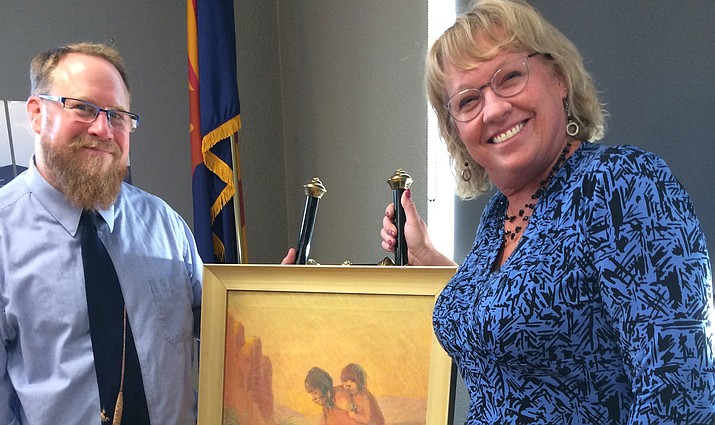
PUSD Superintendent Joe Howard and Assistant Superintendent Mardi Read with the Kate Thomson Cory painting of a Hopi mother and child. (Nanci Hutson/Courier)