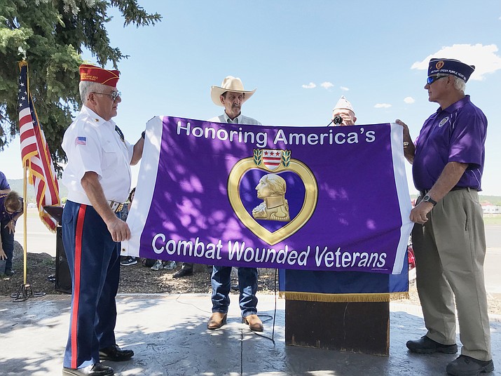 A Purple Heart flag is given to the city of Williams to fly annually on August 7 in honor of Williams' proclamation as a Purple Heart City. (Loretta Yerian/WGCN)