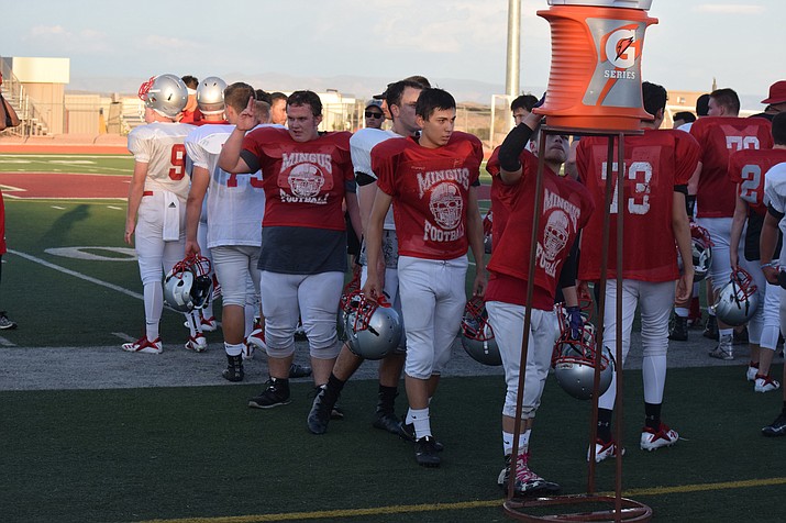 Mingus football players hydrate before the Red and Gray Scrimmage on Aug. 3. VVN/James Kelley