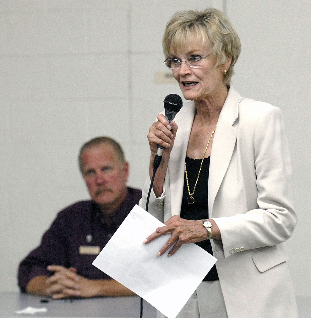 Carol Springer speaks at the debate Tuesday night at the Williamson Valley Fire station #57, with George Seaman October 7, 2008. (Courier file photo)