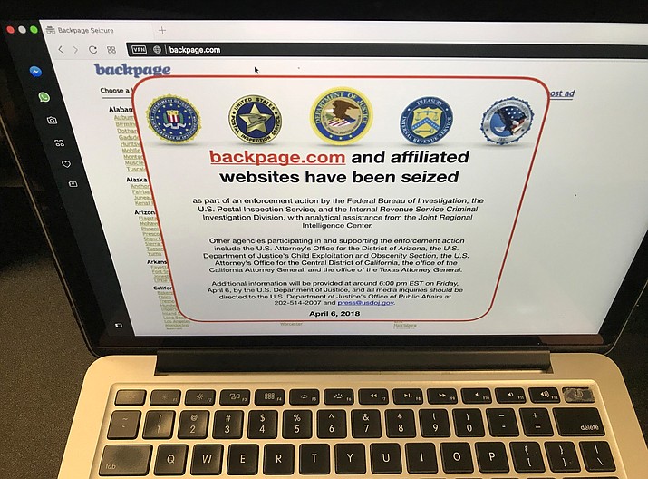 This April 6, 2018, file photo shows a screen shot of Backpage.com on the day that federal authorities seized the classified site as part of a criminal case. Dan Hyer, sales and marketing director for Backpage.com, pleaded guilty Friday, Aug. 17, 2018, in Arizona to conspiring to facilitate prostitution in a scheme to give free ads to prostitutes in a bid to draw them away from competitors. Six others affiliated with Backpage.com face charges in the case. (Damian Dovarganes/AP, File)

