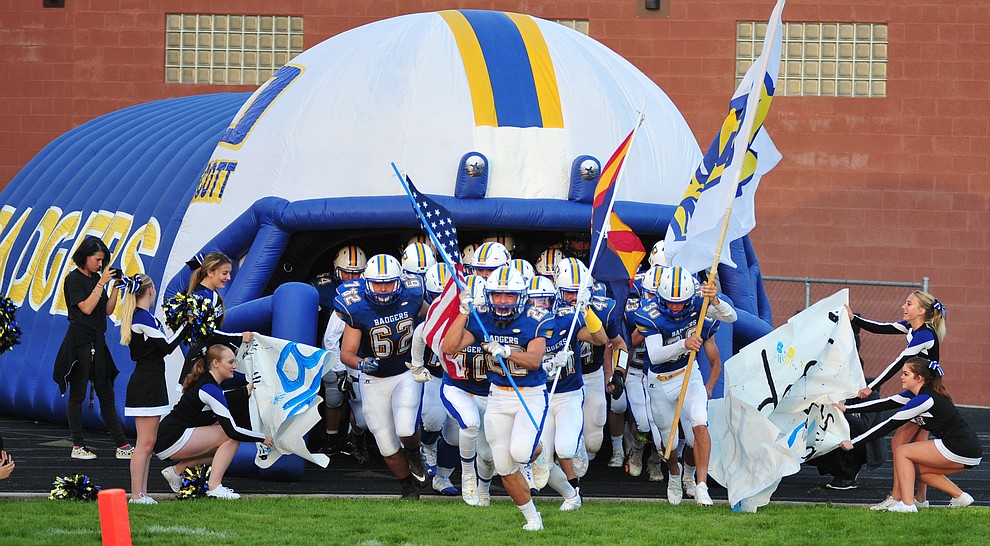 Prescott's players take the field as the Badgers take on Desert Edge Friday August 17, 2018 to open the 2018 football season. (Les Stukenberg/Courier)