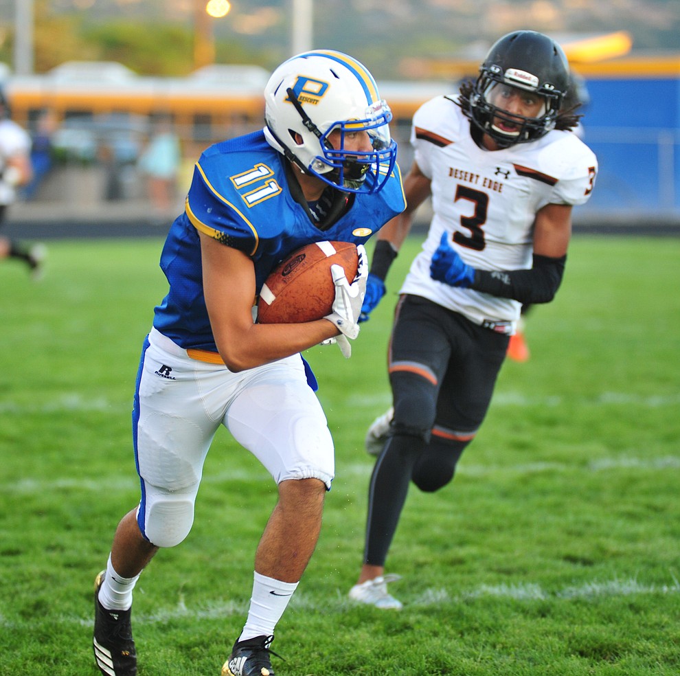 Prescott's Giovanni Ruiz breaks a long run after a pass, that was called back after an inadvertent referee whistle as the Badgers take on Desert Edge Friday August 17, 2018 to open the 2018 football season. (Les Stukenberg/Courier)