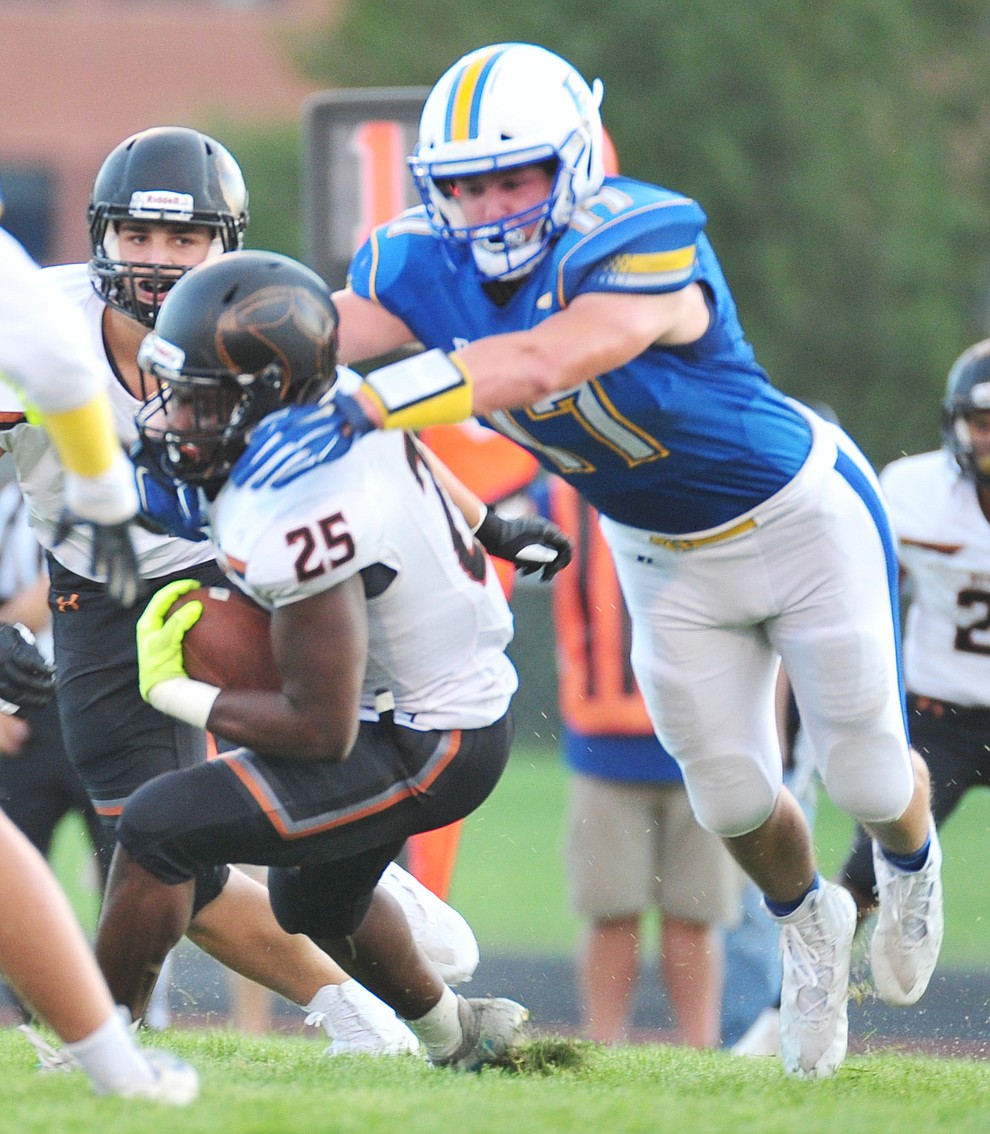 Prescott's Aaron Greenemakes a tackle as the Badgers take on Desert Edge Friday August 17, 2018 to open the 2018 football season. (Les Stukenberg/Courier)