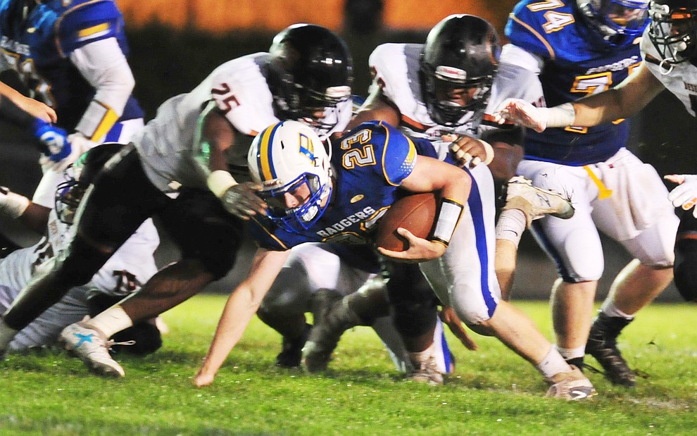 Prescott's Sam Giordan batles for yard as the Badgers take on Desert Edge Friday August 17, 2018 to open the 2018 football season. (Les Stukenberg/Courier)