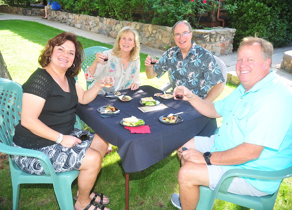 Lois Fruhwirth, Kathi Blake, Bill Blake and Gary Fruhwirth enjoy wine and hors d'oeuvres at the 6th annual Sharlot's WInefest at the Sharlot Hall Museum in Prescott Saturday, August 18, 2018. (Les Stukenberg/Courier)