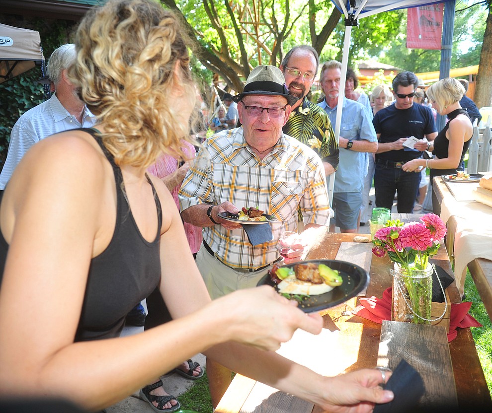Big A served up grilled avacado with braised pork belly at the 6th annual Sharlot's WInefest at the Sharlot Hall Museum in Prescott Saturday, August 18, 2018. (Les Stukenberg/Courier)