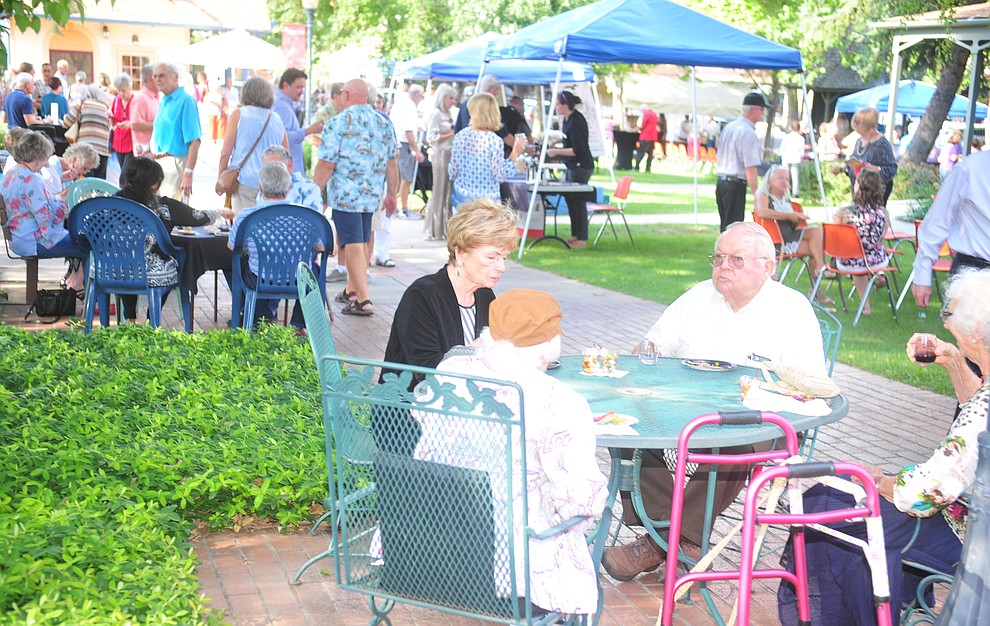 Patrons enjoy the wine and hors d'oeuvres at the 6th annual Sharlot's WInefest at the Sharlot Hall Museum in Prescott Saturday, August 18, 2018. (Les Stukenberg/Courier)