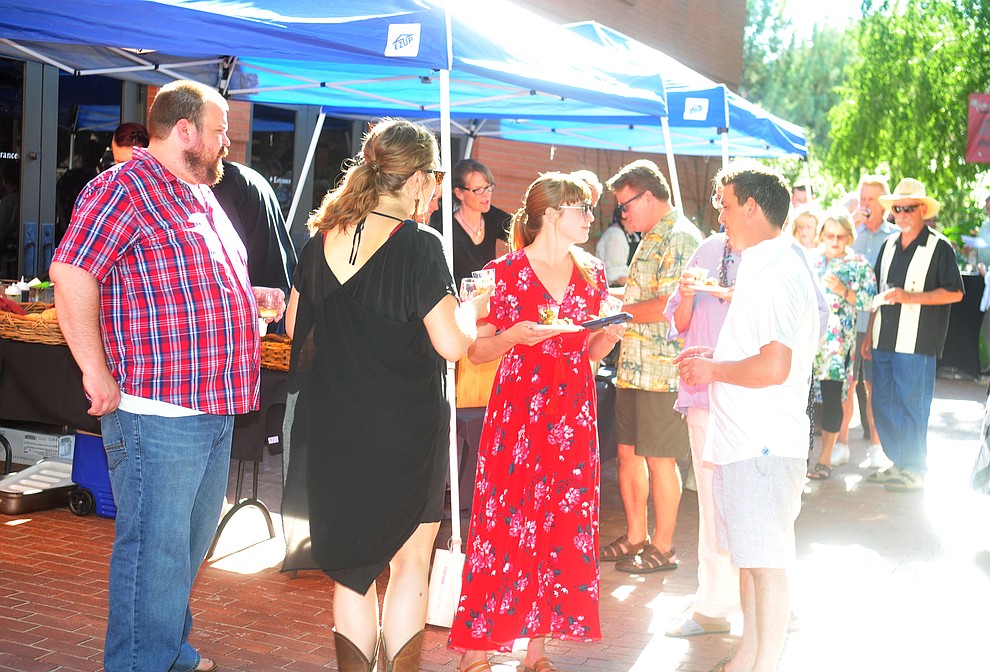 Patrons enjoy the wine and hors d'oeuvres at the 6th annual Sharlot's WInefest at the Sharlot Hall Museum in Prescott Saturday, August 18, 2018. (Les Stukenberg/Courier)