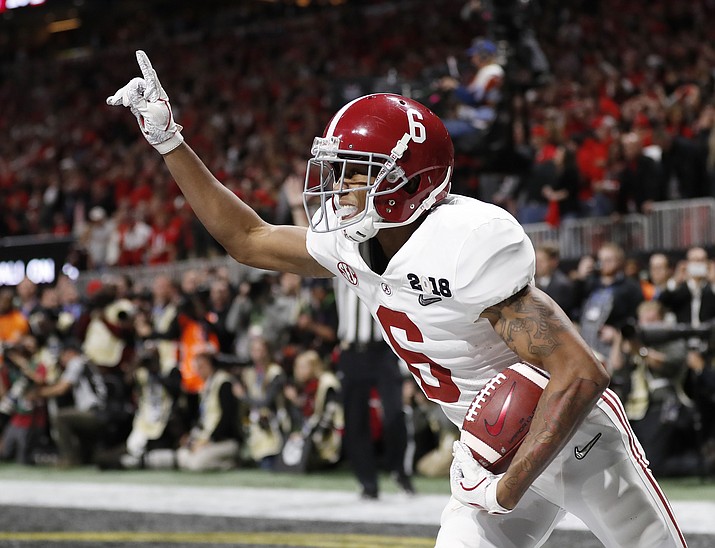 Alabama wide receiver DeVonta Smith (6) celebrates his touchdown during overtime of the NCAA college football playoff championship game against Georgia, in Atlanta, Jan. 8, 2018. The AP preseason Top 25 is out, and for the third straight year Alabama is No. 1. (David Goldman/AP Photo, file)