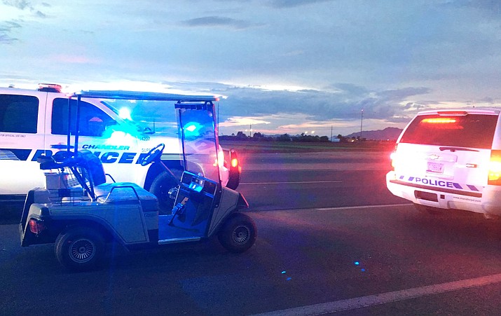 This photo provided by the Arizona Department of Public Safety shows police vehicles that stopped a golf cart traveling westbound on eastbound highway in Chandler, Ariz., Thursday, Aug. 23, 2018. The Arizona Department of Public Safety said in a statement Thursday that the golf cart driver was confused after he was stopped around 5:30 a.m. and told troopers he thought he was leaving a meeting. (Arizona Department of Public Safety via AP)