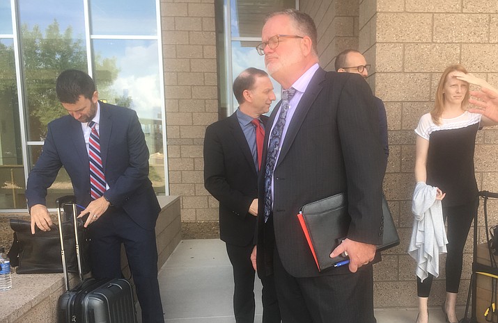 Veteran Mingus Union School Board member James Ledbetter and the Mingus attorneys outside Yavapai County Superior Court Friday after a settlement was reached that cancels the November consolidation election. VVN/Kelcie Grega
