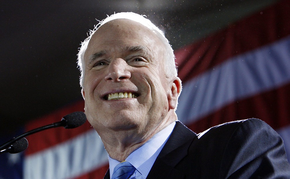 FILE - In this Jan. 29, 2008, file photo, Republican presidential hopeful Sen. John McCain, R-Ariz., celebrates in Miami after winning the Florida Republican presidential primary. Aide says senator, war hero and GOP presidential candidate McCain died Saturday, Aug. 25, 2018. He was 81. (AP Photo/Charles Dharapak, File)